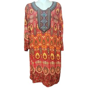 Embroidered dress with blue stones and a multi-colored red dress. The dress is t